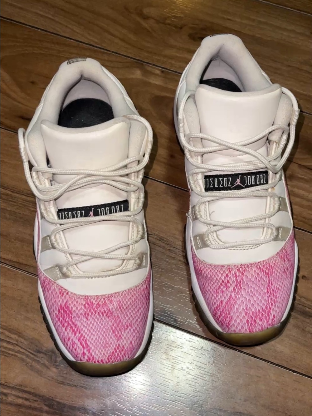 Pink and White Grade School Snakeskin 11s